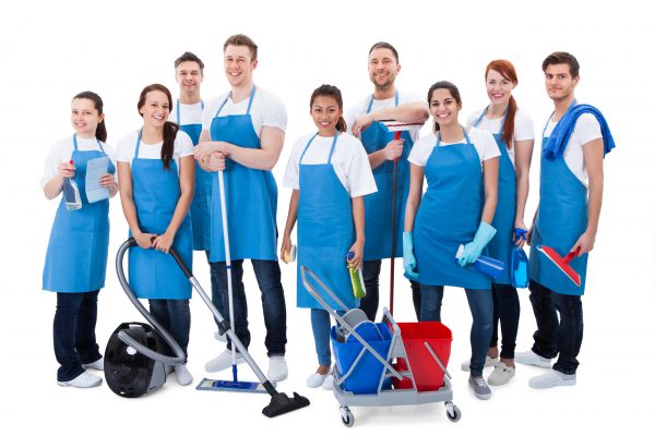 Large,Diverse,Group,Of,Janitors,Wearing,Blue,Aprons,Standing,Grouped